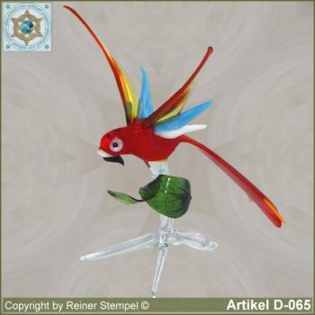 Glass animals, glass birds, glass bird parrot on tree branch with upright wings
