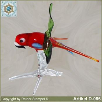 Glass animals, glass birds, glass bird parrot on tree branch red